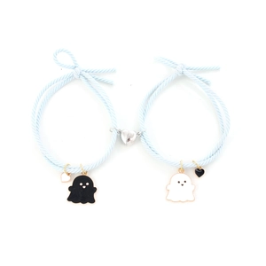 Detail showing heart-shaped magnetic clasp and ghost charms on light blue braided ropes