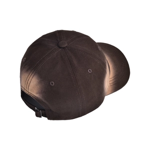 Macro view of vintage washed tie-dye baseball cap featuring back strap and metal buckle