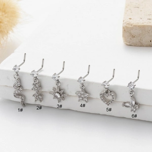 Macro shot of 6 styles of stainless steel L-shaped nose studs with sparkling zircon