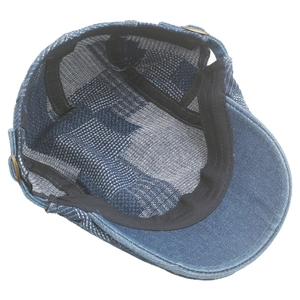 Detail view of denim flat cap showing blue checkered lining and inner sweatband