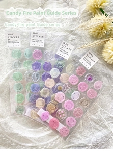 Detailed view of candy-colored wax seal stickers in transparent packaging for scrapbooks