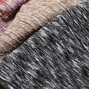 Tie-dye slouchy beanie with textured knit fabric showing bubble gauze and striped patterns