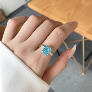 Close-up of S925 silver ring featuring blue square zircon worn on a hand elegantly