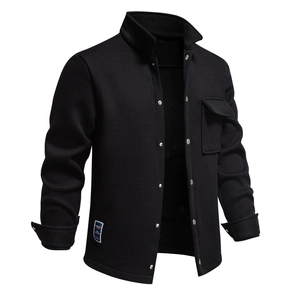 Close-up of waffle knit texture and chest pocket on a black fleece-lined jacket