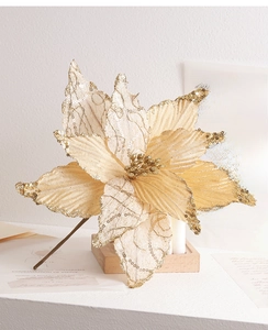 Detail of champagne gold artificial Christmas flower with lace and glitter on wood base
