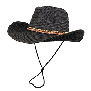 Detail of black straw cowboy hat with metallic beads on brown faux leather band