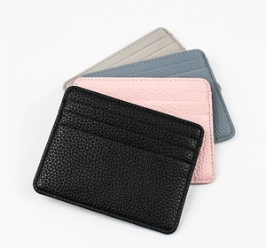 Detail of four colorful lychee textured ultra-thin card holders in a fan arrangement