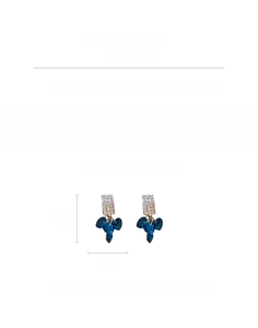 Detailed view of silver needle earrings with blue crystal hearts and pavé square rhinestones