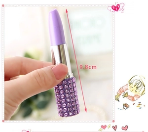 Detail shot of a purple rhinestone lipstick-shaped ballpoint pen with 9.8cm height measurement