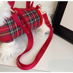 Detail view of Westie plush bag with red tartan pattern and adjustable shoulder strap