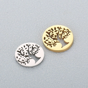 Hollow tree of life pendants in gold and silver finish stainless steel on grey background