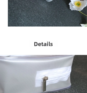 Detail of silver mesh cosmetic bag with high-quality white zipper and metallic slider