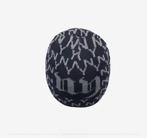 Detailed top view of navy blue fleece-lined knit beanie with repeating NY logo pattern