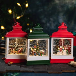 Retro Christmas lantern music box with Santa Claus and tree scenes on wooden table