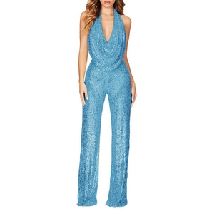 Close-up of sparkling sky blue sequins and deep V-neck halter design on the jumpsuit