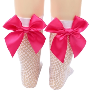 Close-up of white mesh socks for girls featuring large pink decorative bows on the cuffs