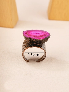 Detail shot of vintage bronze wide band ring with pink agate stone and 1.9cm inner diameter
