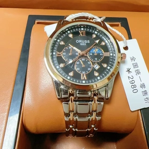 Detail of ORUSS 1853 gold stainless steel watch with black dial in leather gift box