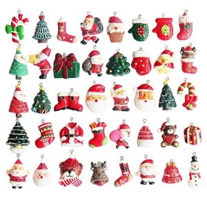 Variety of colorful Christmas resin charms featuring Santa, reindeer and trees on white background