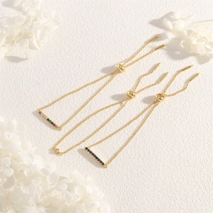 Detailed view of adjustable gold box chains with vibrant colorful cubic zirconia stones