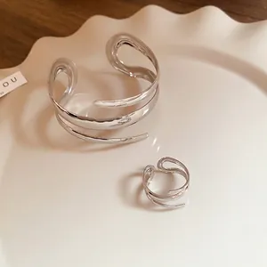 Irregular liquid metal silver cuff bracelet and open ring set in artistic fluid design