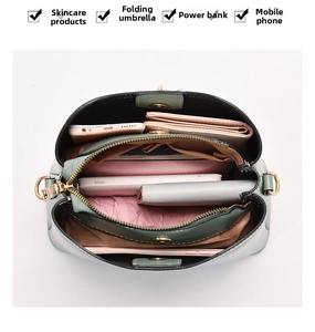 Top view of multi-compartment leather bag showing internal storage for phone and umbrella