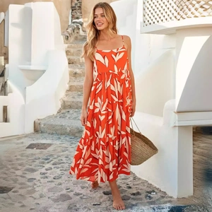 Women's orange floral boho maxi dress with spaghetti straps and open back style