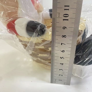 Detailed measurement of a 10.5cm woven Christmas candy basket with a red plush doll