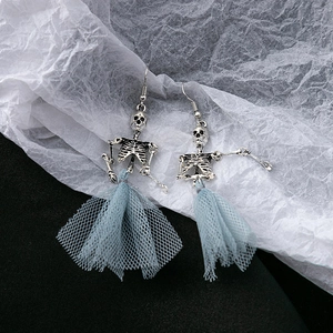 Punk style skeleton earrings with light blue mesh tutu skirt on a contrast background