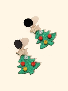 Macro shot of glittery Christmas tree tassel earrings with vibrant festive colors