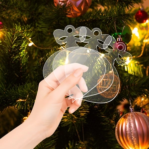Macro shot of clear acrylic Christmas tree ornaments with hanging holes for DIY crafts
