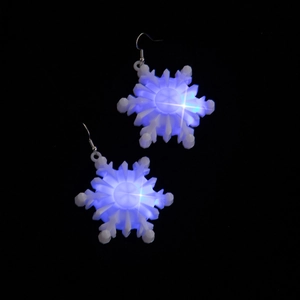 Blue LED glowing snowflake earrings for Christmas with hook on black background