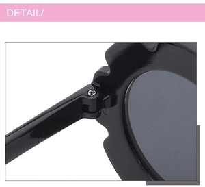 Detailed close-up of the metal hinge and screw assembly on children's flower sunglasses
