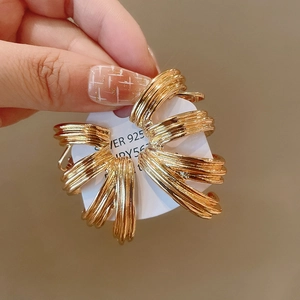 Detail of gold geometric multi-layer hoop earrings with S925 silver needle on card