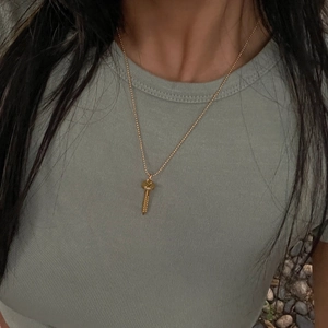 Elegant 18k gold plated key pendant necklace for women in minimalist aesthetic