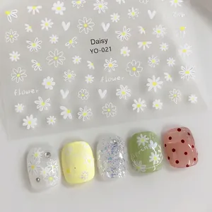 Detail view of YO-021 daisy and flower nail stickers with applied nail art effects