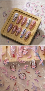 Detail of 3D embossed Chinese style nail stickers with phoenix and peony floral textures