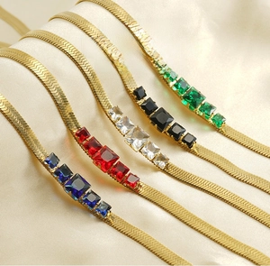 Detail showing five colors of zircon blade necklaces on soft silk background