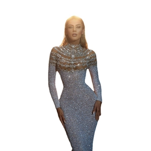 Detail of silver sequined evening gown with sheer chest panel and slim fit design