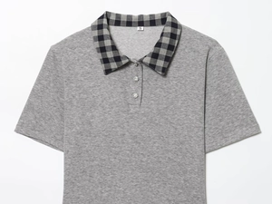 Detail of grey polo shirt featuring plaid collar and sparkling rhinestone buttons