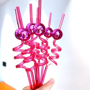 Detailed close-up of pink electroplated spiral straws with mini disco mirror balls