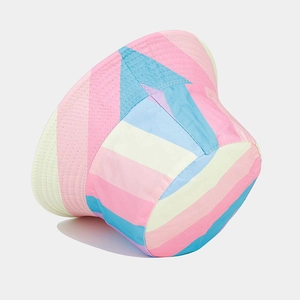 Detailed close-up of rainbow striped fisherman hat with macaron pastel color panels