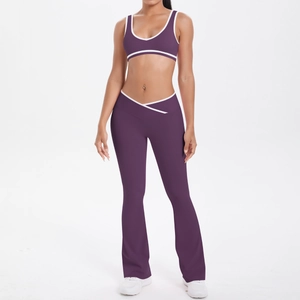 Detail of cross-waist flare yoga pants with contrast piping in plum purple and white
