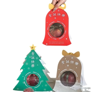 Three assorted Christmas gift boxes for apples and candies in bell and tree shapes
