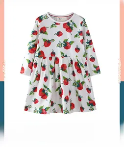 Detail of soft cotton girl's long-sleeve dress with red and green strawberry prints