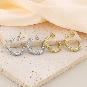 Polished C-shape stainless steel earrings with sparkling pavé cubic zirconia in gold and silver
