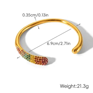Macro shot of 18k gold plated open bangle featuring multi-color rainbow rhinestones inlay