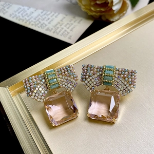 Pink bow crystal earrings with rectangular gemstone pendants in rose gold finish