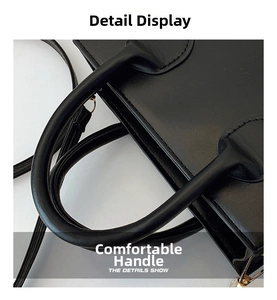 Detailed macro view of the black leather handbag handle with reinforced stitching