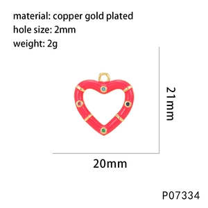 Detail of red enamel heart charm in copper gold plated with colorful zircons